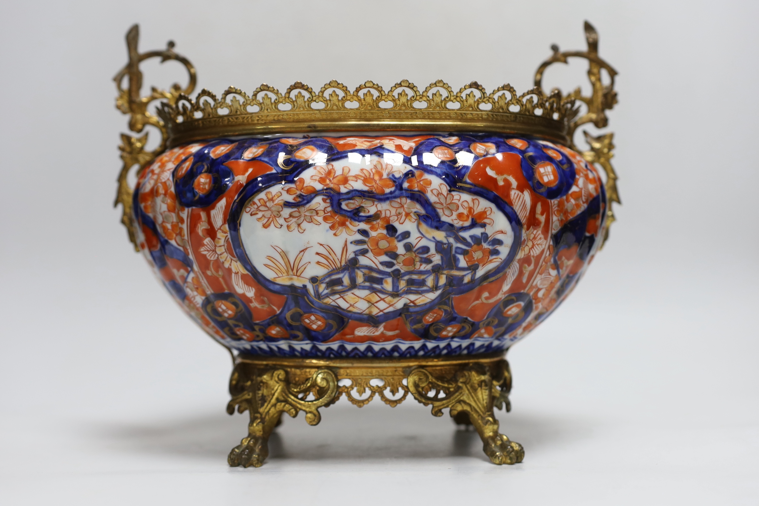 An Imari planter with ornate brass mounts and handles, 24cm high base to top of handles